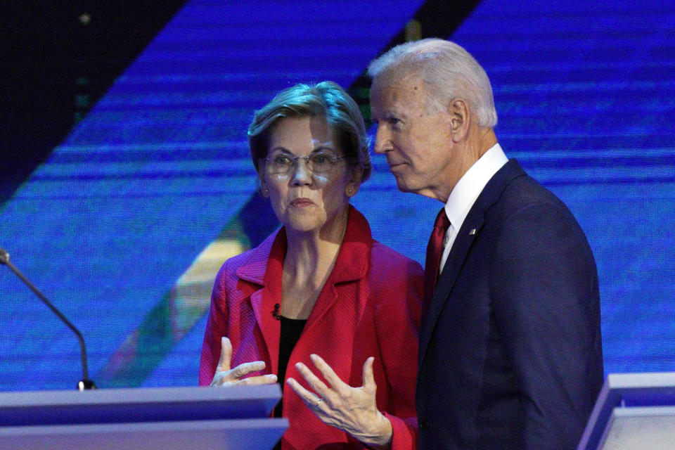 Democratic presidential candidates Sen. Elizabeth Warren, D-Mass., left, and former Vice President Joe Biden talk during a break Thursday, Sept. 12, 2019, in a Democratic presidential primary debate hosted by ABC at Texas Southern University in Houston. (AP Photo/David J. Phillip)