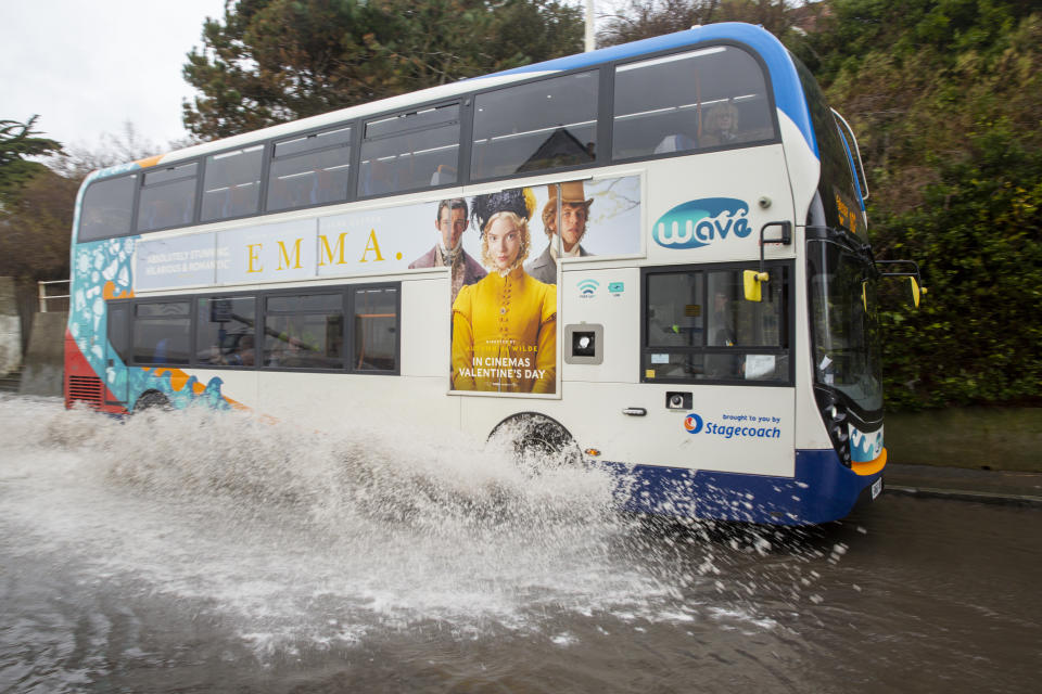 A stagecoach local bus drives  down the A259 between Folkestone and Hythe which is flooded at Sandgate, Kent on the south coast of England, as Storm Ciara continues to sweep over the country on February 10th 2020 in Folkestone, United Kingdom. Amber weather warnings were put into place by the MET office as gusts of up to 90mph and heavy rain swept across the UK. An amber warning from the MET office expects a powerful storm that will disrupt air, rail and sea links travel, cancel sports events, cut electrical power and damage property.  (photo by Andrew Aitchison / In pictures via Getty Images)