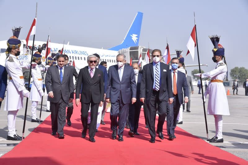 Abdul Razak Dawood, Advisor to the Prime Minister of Pakistan on Commerce and Investment walks with Head of the Afghanistan's peace council, Abdullah Abdullah, upon his arrival in Islamabad