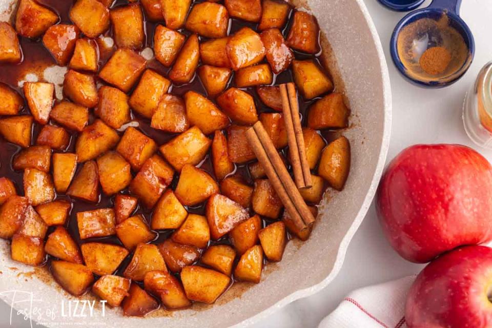 <p>Tastes of Lizzy T</p><p>These cinnamon-fried apples will melt in your mouth! Softened apples in a butter, sugar and cinnamon mixture. A delicious side dish or dessert recipe. </p><p><strong>Get the recipe: <em><a href="https://www.tastesoflizzyt.com/cinnamon-fried-apples/" rel="nofollow noopener" target="_blank" data-ylk="slk:Cinnamon Fried Apples;elm:context_link;itc:0;sec:content-canvas" class="link ">Cinnamon Fried Apples</a></em></strong></p><p><strong>Related: <a href="https://parade.com/1311200/parade/eggnog-cinnamon-rolls/" rel="nofollow noopener" target="_blank" data-ylk="slk:How to Make Eggnog Cinnamon Rolls;elm:context_link;itc:0;sec:content-canvas" class="link ">How to Make Eggnog Cinnamon Rolls</a></strong></p>