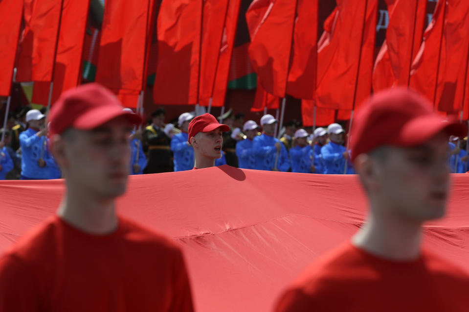 People perform during the Victory Day military parade that marked the 75th anniversary of the allied victory over Nazi Germany, in Minsk, Belarus, Saturday, May 9, 2020. Belarus remains one of the few countries that hadn't imposed a lockdown or restricted public events despite recommendations of the World Health Organization. (AP Photo/Sergei Grits)