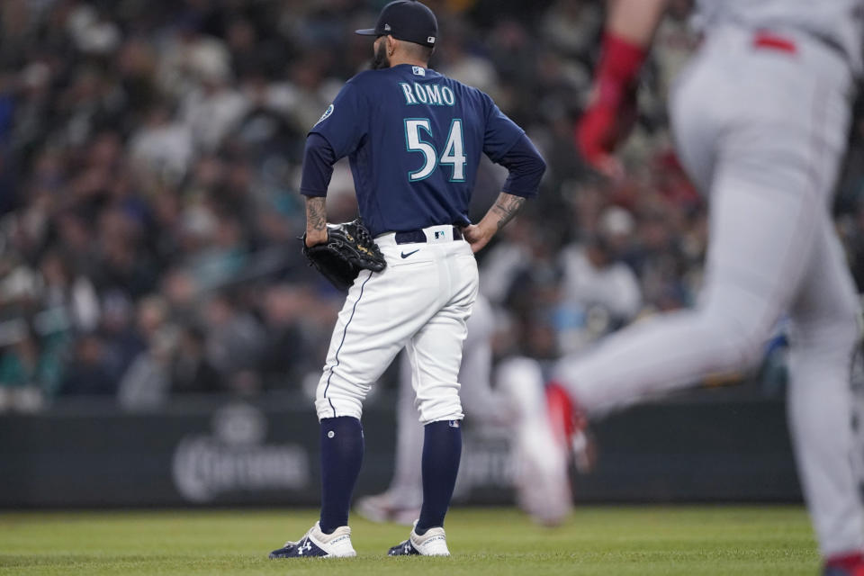 Seattle Mariners pitcher Sergio Romo stands near the mound after giving up a two-run home run to Los Angeles Angels' Jared Walsh during the seventh inning of the second baseball game of a doubleheader, Saturday, June 18, 2022, in Seattle. (AP Photo/Ted S. Warren)
