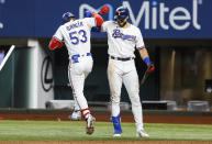 Texas Rangers' Adolis Garcia (53) is congratulated by Joey Gallo after hitting a solo home run during the sixth inning of a baseball game against the Oakland Athletics, Wednesday, June 23, 2021, in Arlington, Texas. (AP Photo/Brandon Wade)