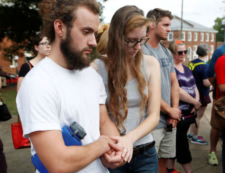 Participants of "Charlottesville to D.C: The March to Confront White Supremacy" pray before beginning a ten-day trek to the nation's capital from Charlottesville, Virginia, U.S. August 28, 2017. REUTERS/Julia Rendleman