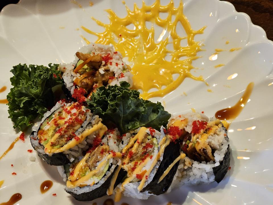 Katsunori Sushi's popular Spider Roll is soft shell crab, crabmeat, avocado and cucumber with a "spider web" accent on the plate.