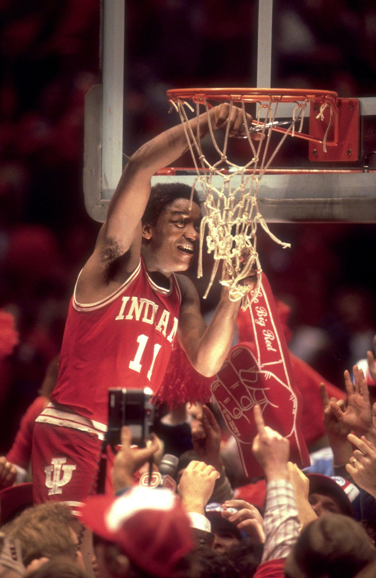 Indiana guard Isiah Thomas (11) cuts the net after winning the NCAA Men's National Basketball semifinal game held in Philadelphia PA at The Spectrum. Indiana defeated LSU 67-49 in March 1981.