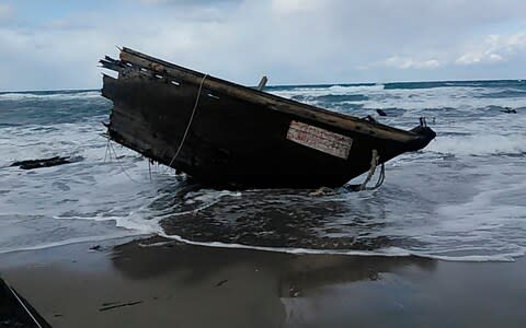 The boat suspected of being from North Korea  - Credit: Sado Coast Guard Station via AP