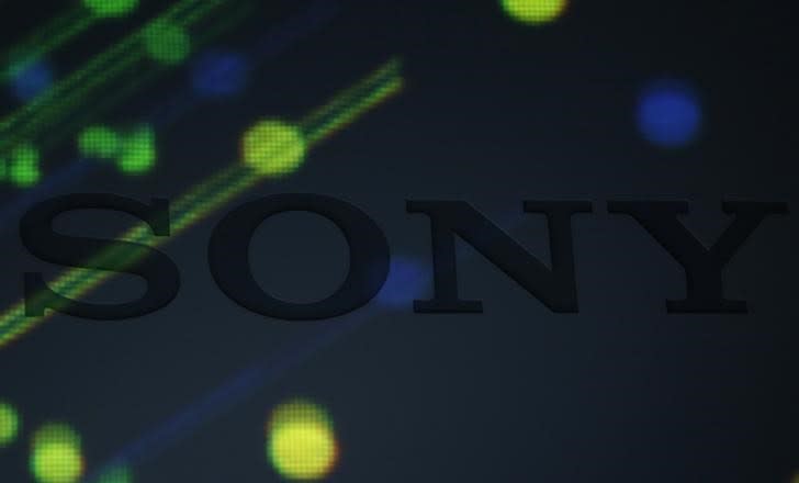 Various lights are cast on a logo of Sony Corp on a podium during its high resolution audio products unveiling event in Tokyo September 25, 2014. REUTERS/Yuya Shino