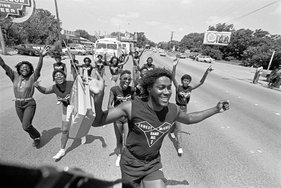 Fans of the Ernest McGhee Band are led in the Fort Worth Juneteenth parade festivities by his brother, Joe McGhee, in 1983.