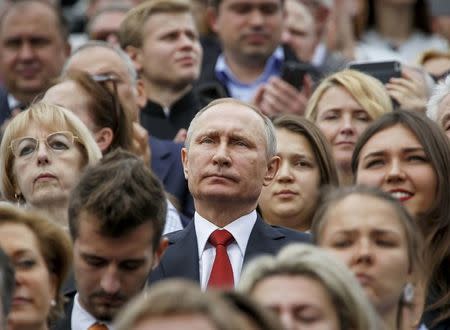 FILE PHOTO: Russian President Vladimir Putin watches the celebrations for the City Day in Moscow, Russia, September 10, 2016. REUTERS/Sergei Karpukhin/File Photo