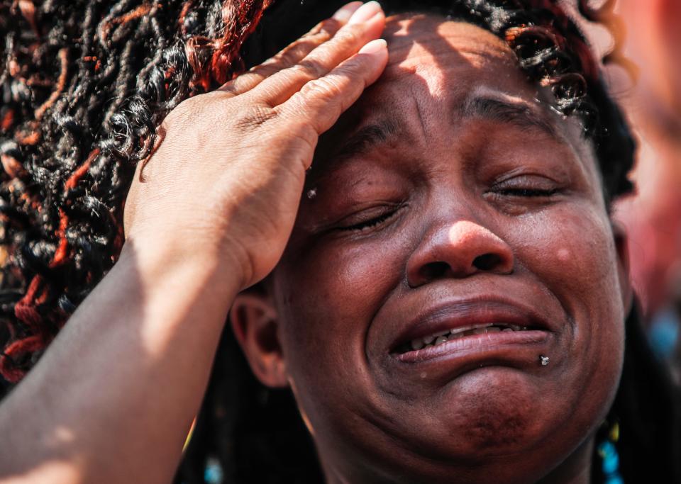 Tamika Palmer, the mother of Breonna Taylor, the 26-year-old Black woman killed by LMPD who were executing a no-knock search warrant at her apartment in March, cries on the steps of Metro Hall during Taylor's remembrance June 5.