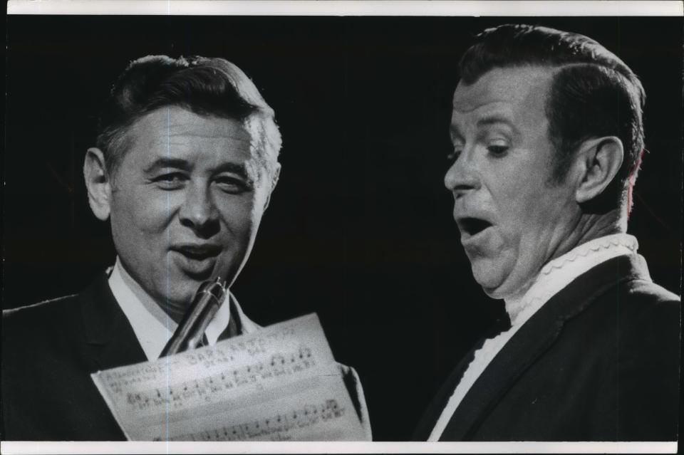 Milwaukee Mayor Henry Maier and singer Dennis Day, one of the stars of Jack Benny's old radio show, join their voices in a German Christmas carol during the city's tree-lighting program on Dec. 1, 1968. Day, a frequent visitor to Milwaukee, was the guest performer on the program, held at the Milwaukee Arena. This photo was published in the Dec. 2, 1968, Milwaukee Journal.