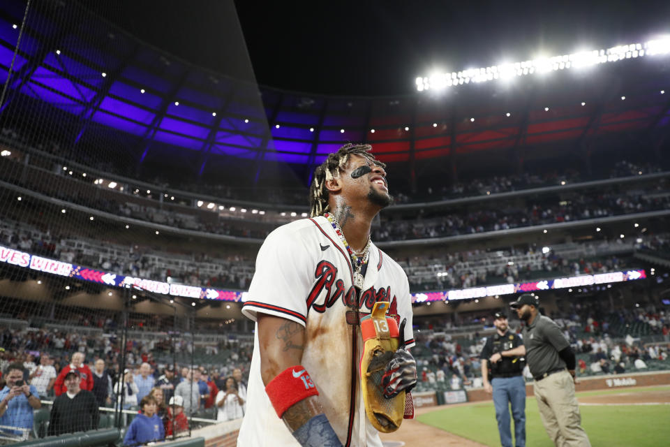 Atlanta Braves' Ronald Acuña Jr. reacts after scoring the winning run against the Chicago Cubs in a baseball game Wednesday, Sept. 27, 2023, in Atlanta. (Miguel Martinez/Atlanta Journal-Constitution via AP)