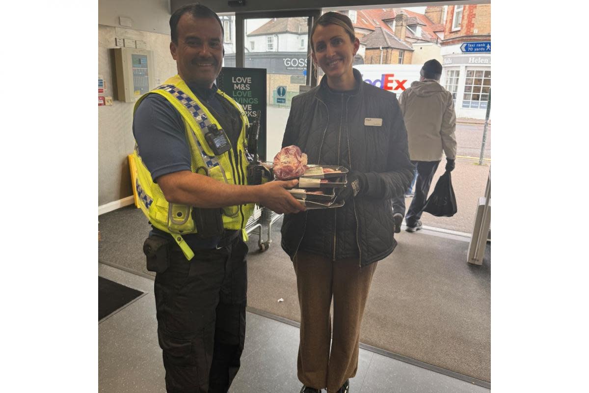 PCSO Harold reuniting meat with M&S worker <i>(Image: Bournemouth police)</i>