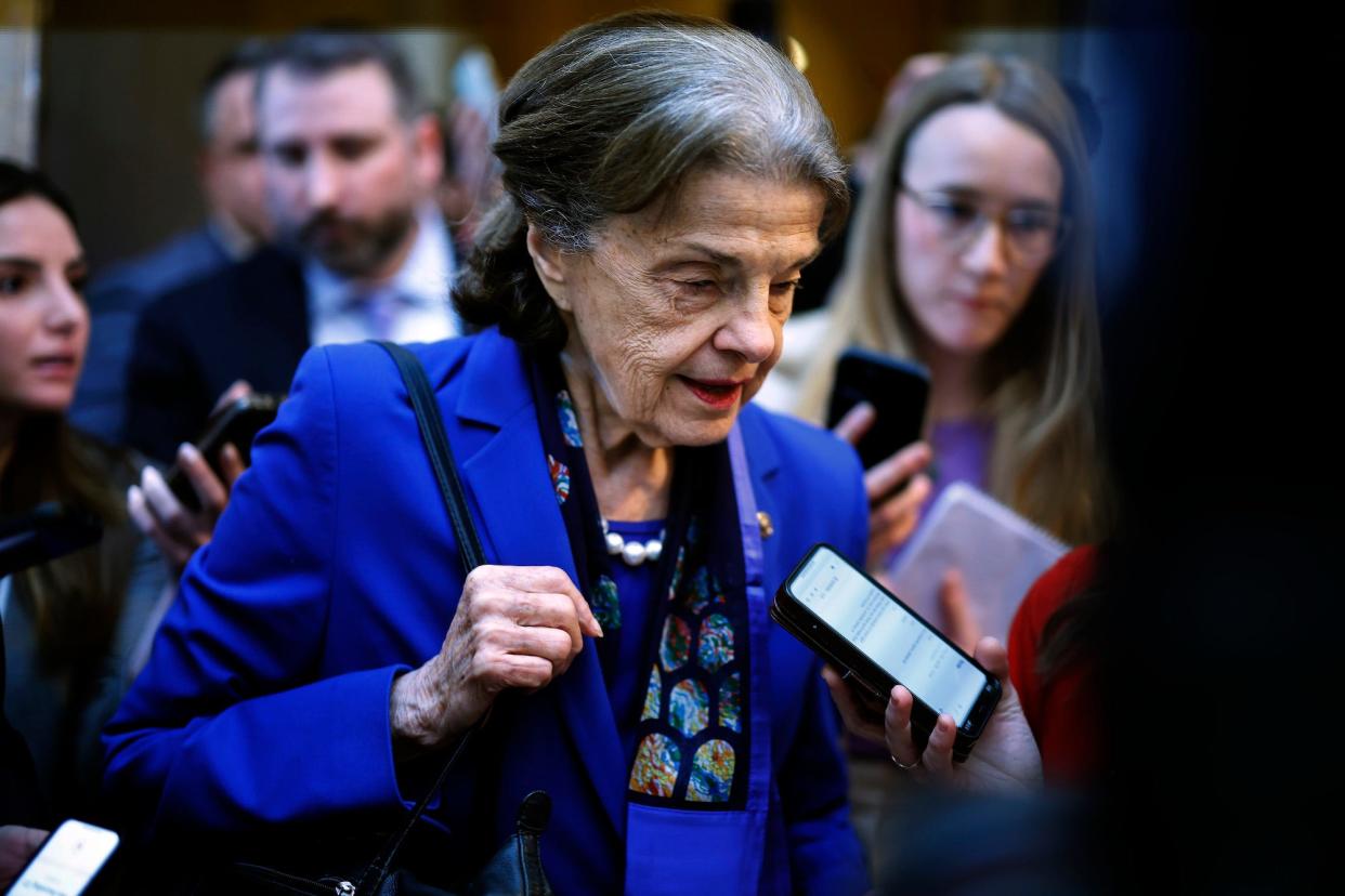 Democratic Sen. Dianne Feinstein of California is surrounded by reporters as she heads to the Senate chamber for a vote in the US Capitol on February 14, 2023 in Washington, DC.