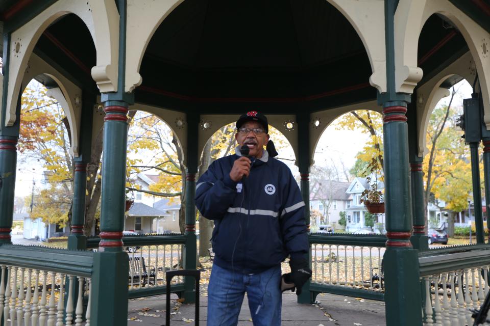 George Fontenette addresses a crowd getting ready for a walking tour of Clarissa Street.