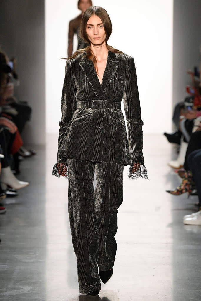 <p>Model wears a velvet gray pantsuit at the fall 2018 Jonathan Simkhai show. (Photo: Getty Images) </p>