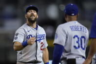 Los Angeles Dodgers' Steven Souza, left, smiles as he celebrates with manager Dave Roberts (30) after the final out of the team's baseball game against the Arizona Diamondbacks on Friday, June 18, 2021, in Phoenix. The Dodgers won 3-0. (AP Photo/Ross D. Franklin)