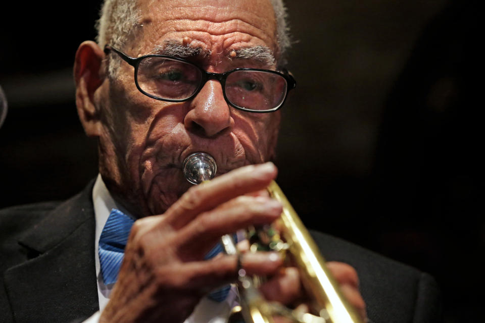 Dixieland jazz musician Lionel Ferbos performs at his 102nd birthday party at the Palm Court Jazz Cafe in New Orleans, Wednesday, July 17, 2013. Ferbos, who bought his first cornet at Rampart Street pawn shop when he was 15, is believed to be the oldest actively working musician in the city. His body isn’t without signs of age. He’s been in and out of the hospital in recent years and had a pacemaker implanted last year. He sometimes uses a wheelchair to get around, but he remains determined to sing and blow. (AP Photo/Gerald Herbert)