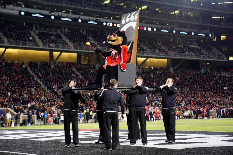 The Cincinnati Bearcat mascot is lifted on a throne in the third quarter during the American Athletic Conference championship football game against the Houston Cougars.