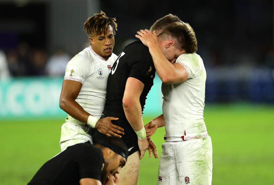 YOKOHAMA, JAPAN - OCTOBER 26: Jordie Barrett of New Zealand and Owen Farrell of England embrace after the match during the Rugby World Cup 2019 Semi-Final match between England and New Zealand at International Stadium Yokohama on October 26, 2019 in Yokohama, Kanagawa, Japan. (Photo by Richard Heathcote - World Rugby/World Rugby via Getty Images)