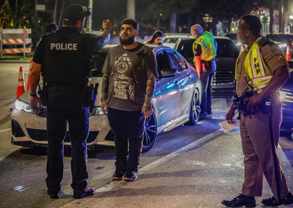 Miami Beach police detective Richard Rodriguez and a Florida Highway Patrol trooper conduct a sobriety exercise at a DUI checkpoint in South Beach during spring break in Miami Beach, Florida, on Saturday, March 9, 2024.
