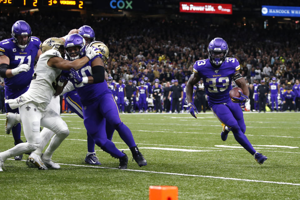 Minnesota Vikings running back Dalvin Cook (33) carries near the goal line in the first half of an NFL wild-card playoff football game against the New Orleans Saints, Sunday, Jan. 5, 2020, in New Orleans. (AP Photo/Butch Dill)