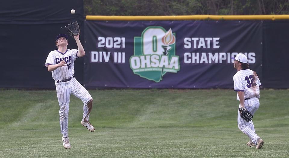 CHCA outfielder Jack Vogele (12) catches a fly ball as his teammate  Johnathan Russell looks on during their baseball game against Cincinnati Country Day  Tuesday, April 12, 2022.