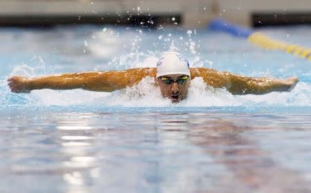 May 16, 2014; Charlotte, NC, USA; Michael Phelps swims the 100 meter butterfly during the Arena Grand Prix at Mecklenburg County Aquatic Center. Mandatory Credit: Jeremy Brevard-USA TODAY Sports