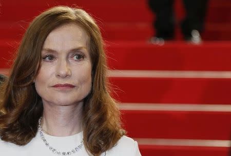 Cast member Isabelle Huppert poses on the red carpet as she arrives for the screening of the film "Louder Than Bomb" (Plus fort que les bombes) in competition at the 68th Cannes Film Festival in Cannes, southern France, May 18, 2015. REUTERS/Regis Duvignau