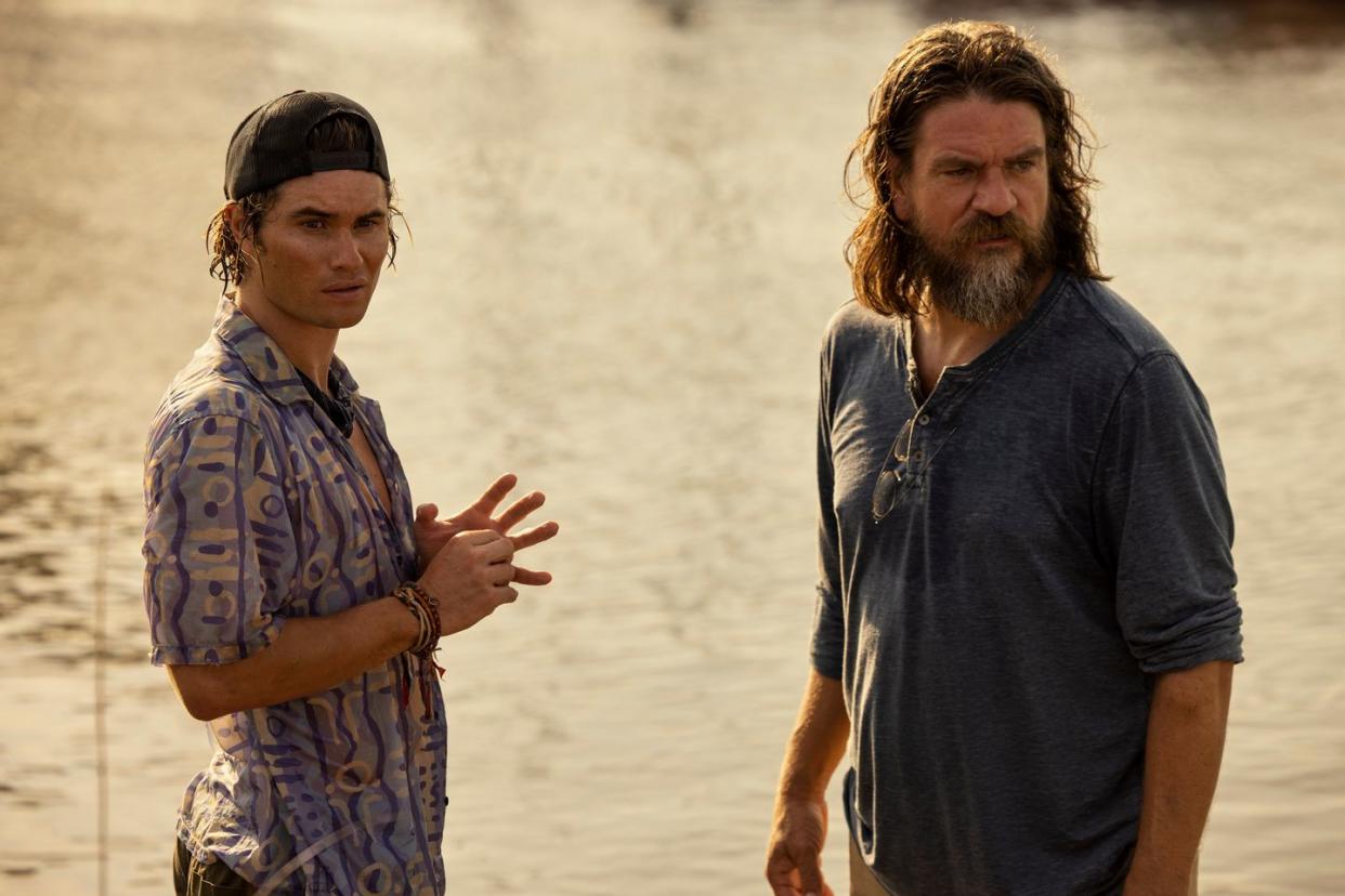 Outer Banks (from left to right): Chase Stokes as John B., Charles Halford as Big John in episode 304 of Outer Banks (cr Jackson Lee Davis)Netflix © 2023