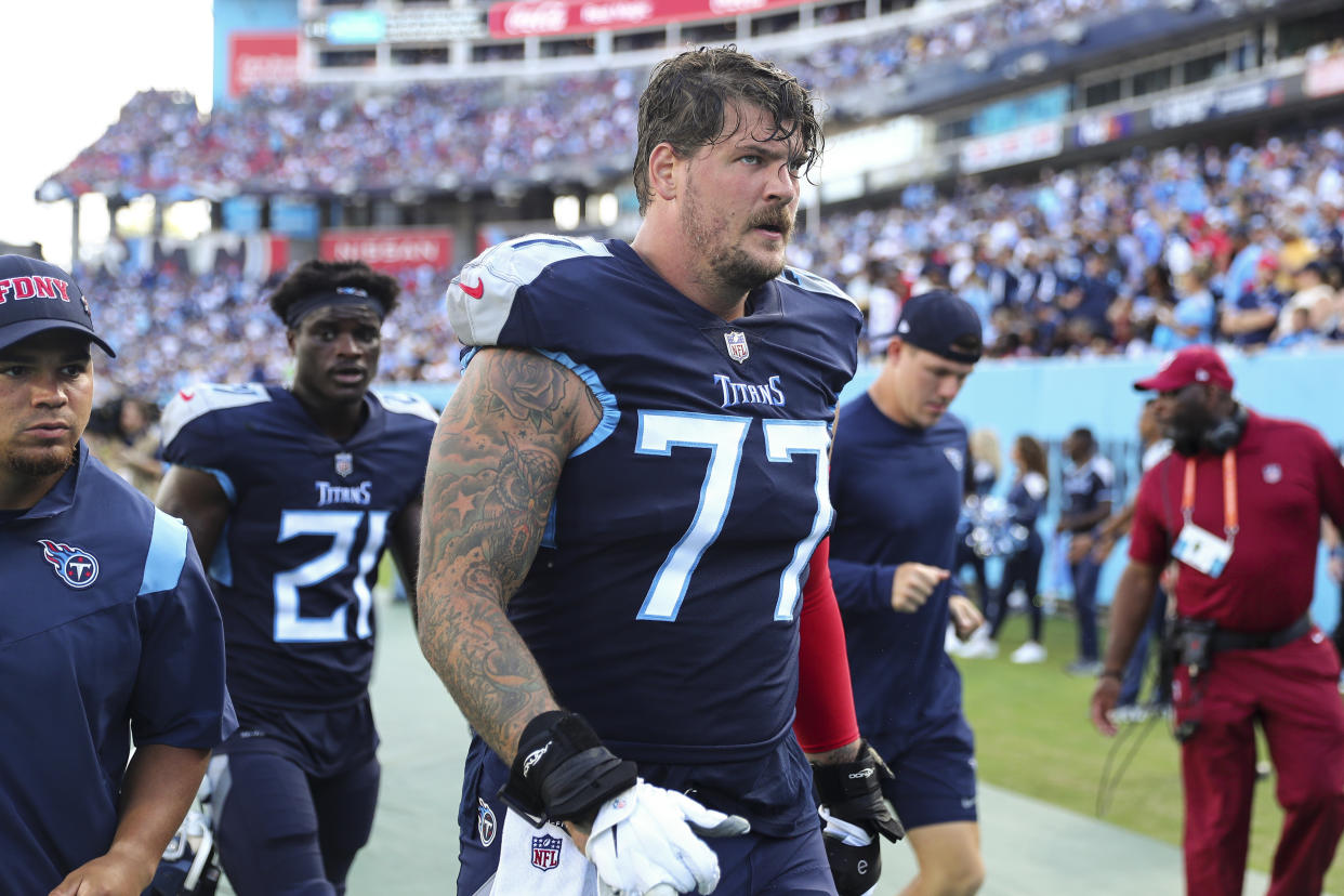 Taylor Lewan played nine years for the Titans. (Photo by Kevin Sabitus/Getty Images)