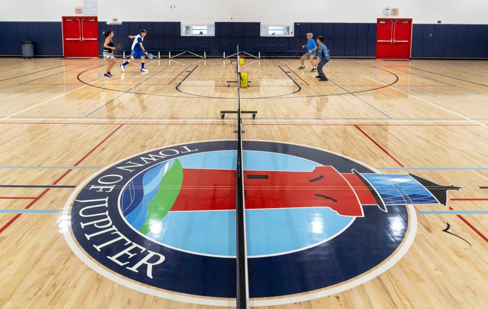 Jupiter Community Center gym does double time as space for six mobile indoor courts.