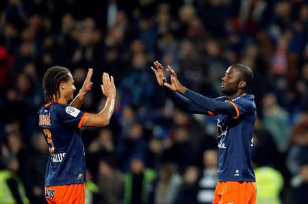 Football Soccer - Montpellier v Paris St Germain - French Ligue 1 - Mosson stadium, Marseille, France 03/12/2016 - Montpellier's Daniel Congre (L) and Cedric Moncongu react at the end of their match against Paris St Germain. REUTERS/Jean-Paul Pelissier