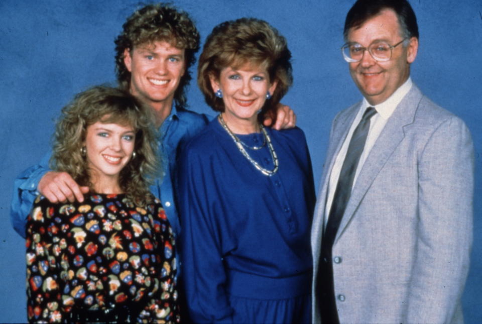 The Ramsay family on Neighbours: Kylie Minogue as Charlene Mitchell, Craig Mclachlan as Henry, Anne Charleston as Madge Bishop, Ian Smith as Harold Bishop. (Fremantle Media/Shutterstock)