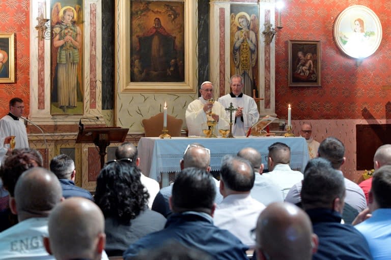 This handout picture released by the Vatican shows Pope Francis leading a mass for inmates at the Paliano prison known for housing collaborators of justice who inform on old mobster allies, on April 13, 2017 in Paliano, during Holy Thursday