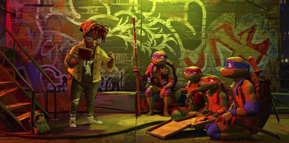 This image released by Paramount Pictures shows, from left, April O'Neil, voiced by Ayo Edebiri, Donatello, voiced by Micah Abbey, Raphael, voiced by Brady Noon, Michelangelo, voiced by Shamon Brown Jr., and Leonardo, voiced by Nicolas Cantu in a scene from "Teenage Mutant Ninja Turtles: Mutant Mayhem." (Paramount Pictures via AP)