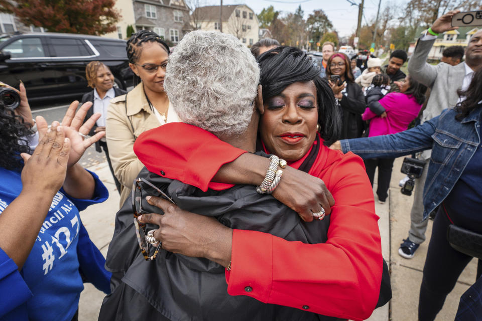 Democratic candidate for Philadelphia Mayor Cherelle Parker, right, hugs Ward leader Steven Jones, of the 52nd district, who campaigned for Parker, at Pinn Memorial Baptist Church on Election Day, Tuesday, Nov. 7, 2023, in Philadelphia. (Jessica Griffin/The Philadelphia Inquirer via AP)