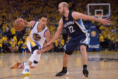 May 3, 2015; Oakland, CA, USA; Golden State Warriors guard Stephen Curry (30) dribbles the basketball against Memphis Grizzlies guard Nick Calathes (12) during the third quarter in game one of the second round of the NBA Playoffs at Oracle Arena. Kyle Terada-USA TODAY