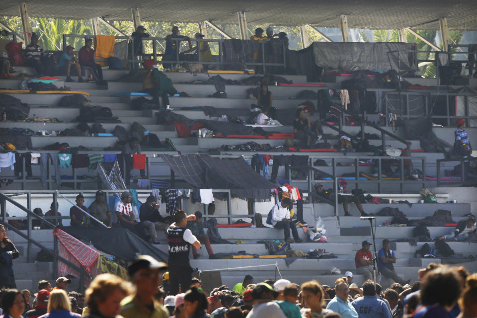 Central American migrants settle in a shelter at the Jesus Martinez stadium in Mexico City, Tuesday, Nov. 6, 2018. Humanitarian aid converged around the stadium in Mexico City where thousands of Central American migrants winding their way toward the United States were resting Tuesday after an arduous trek that has taken them through three countries in three weeks. (AP Photo/Marco Ugarte)