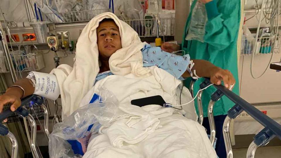 Palm Bay surfer Chris Pospisil recuperates from surgery at Halifax Health Medical Center of Daytona Beach after he was bitten by a shark at New Smyrna Beach.