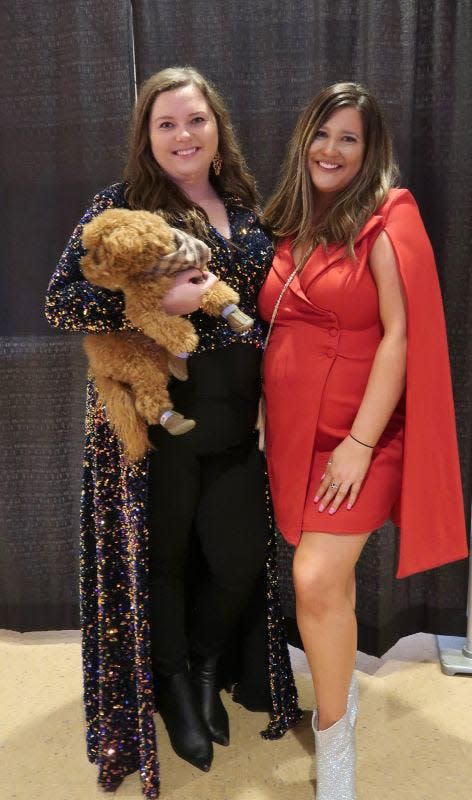 Katie Corder and Natalie Childress and Dolce Kayne (dog) attended the Lights, Camera, Fashion 2023 presented by My Best Friend Jenna Bridal Formal on Thursday, February 16, 2023, at the Carl Perkins Civic Center in downtown Jackson, Tennessee.  The event, featuring high school juniors and seniors as models, is the largest prom fashion show in the Mid-South region and is held annually to benefit St. Jude Children's Research Hospital. This year, the event raised over $240,000 for St. Jude.