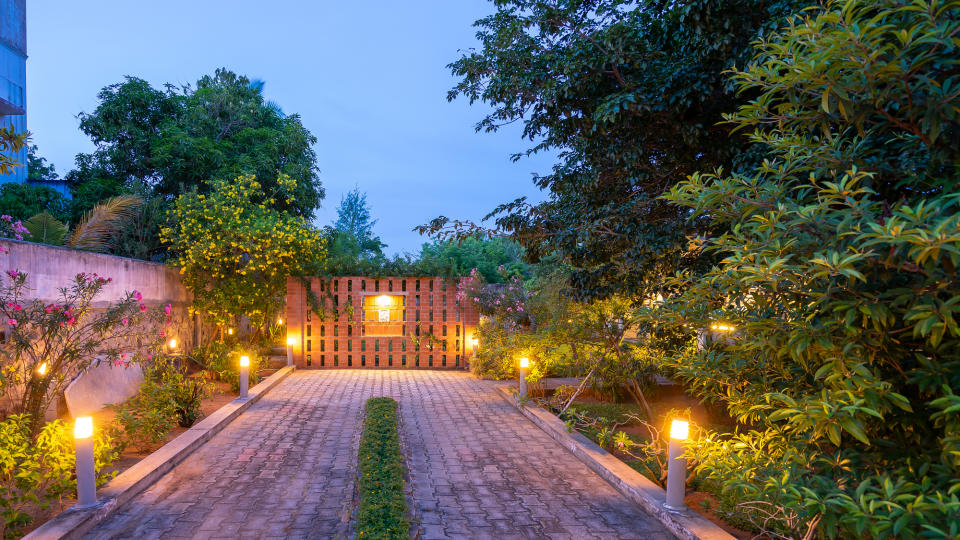 A pathway lit with tall lights