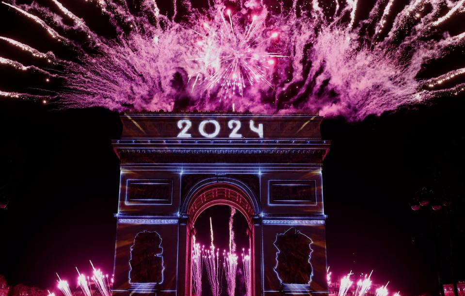 The Arc de Triomphe is lit up during the New Year’s celebration (REUTERS)