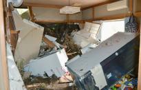 Furniture and electrical appliances are scattered following a landslide caused by Typhoon Wipha in Ibaraki, North of Tokyo, in this photo taken by Kyodo October 16, 2013. Eight people were killed and over 30 missing, with nearly 20,000 people ordered to evacuate and hundreds of flights cancelled as Typhoon Wipha pummelled the Tokyo region on Wednesday, leaving piles of wreckage on one small island but largely sparing the capital. (REUTERS/Kyodo)