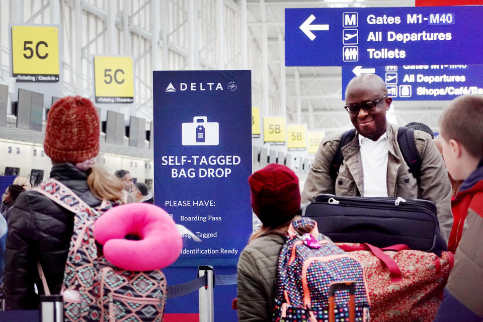 Passengers check in at Chicago’s O’Hare International Airport in January.  (Scott Olson / Getty Images)