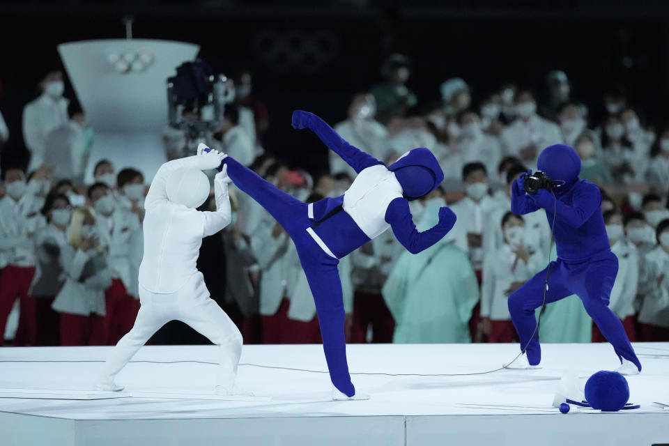 Actors perform during the opening ceremony at the Tokyo Summer Olympics. - Credit: AP