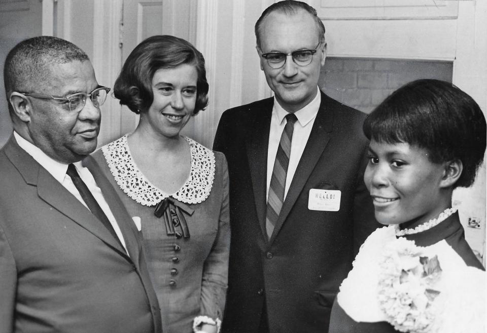 The Rev. Stanley E. Lynton, counselor Norma Routson and the Rev. Ralph Lamb congratulate STRIDE program scholarship winner Eula Thomas in 1969.