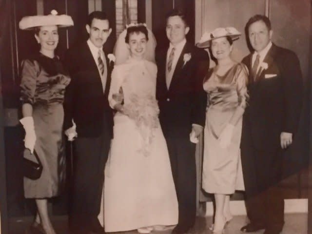Bride Anita and Groom Pablo on their wedding day in 1957, posing with their parents. Anita wore a different wedding dress that was also made by her mother.&nbsp; (Photo: Courtesy of Marta Prietto O'Hara)