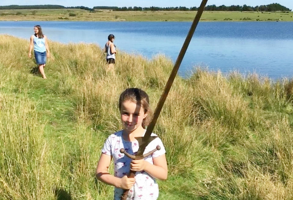 Matilda Jones, from Norton, Doncaster, with the sword.  A schoolgirl could become a thing of legend after pulling an historic sword from the same Cornish lake where King Arthur's Excalibur was famously thrown.  See ROSS PARRY story RPYSWORD.  Little Matilda Jones. Aged seven, came home with the perfect holiday souvenir after stumbling across the sword which is the same height as her.  She found the 4ft long metal blade while paddling in waist deep waters at Dozmary Pool on August 29.  Proud dad Paul Jones, 51, had only told Matilda and her sister Lois, four, about the legend of King Arthur moments before the discovery during a six-day holiday in Cornwall.  The 51-year-old, from Doncaster, south Yorks., predicts that the sword is probably around 30 years old and was used as an old film prop.